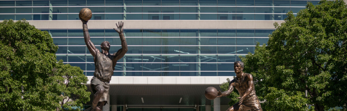 Vivint Smart Home Arena with NBA Utah Jazz basketball statues in Salt Lake City, Utah, USA.