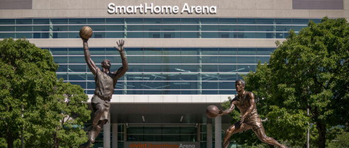 Vivint Smart Home Arena with NBA Utah Jazz basketball statues in Salt Lake City, Utah, USA.