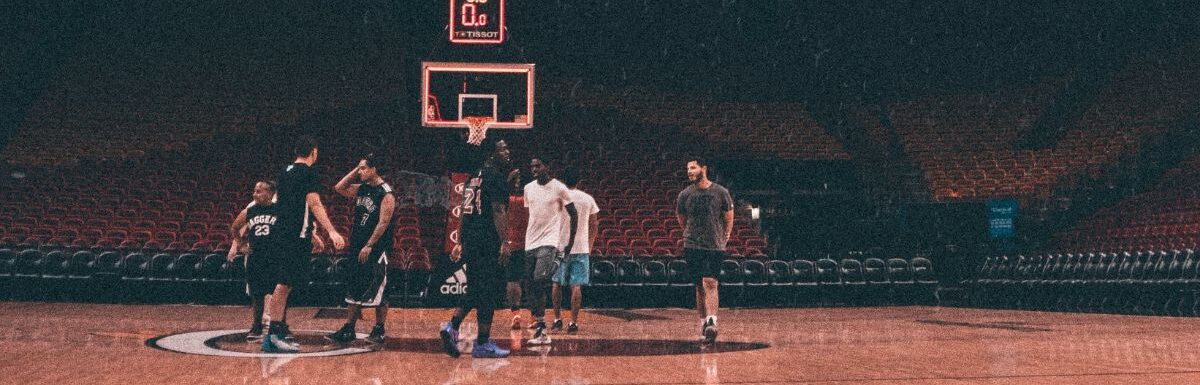 Players inside a basketball court.