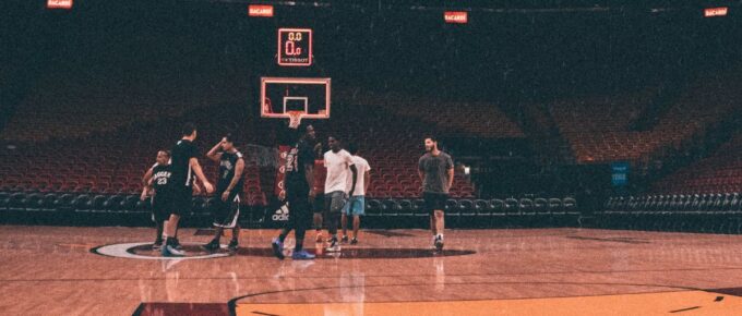 Players inside a basketball court.