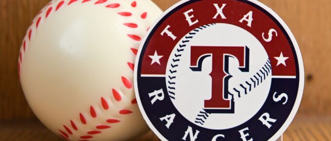 The emblem of the baseball club Texas Rangers and a baseball.