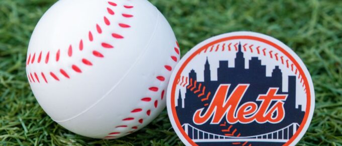 The emblem of the New York Mets baseball club and a baseball.