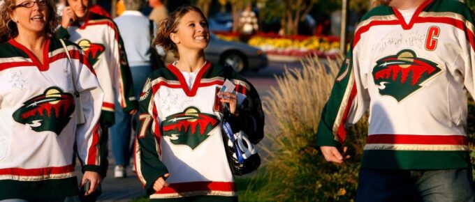 Fans wearing Minnesota Wild jackets.