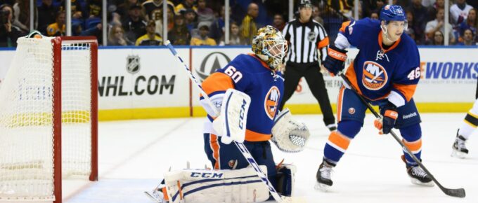 New York Islanders Goalie Kevin Poulin and defenseman Matt Donovan protect the net against the Boston Bruins at Nassau Coliseum.