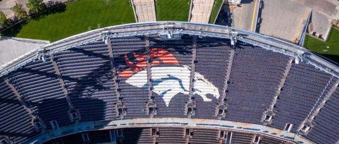 Aerial Top down of Denver Broncos logo in Stadium.
