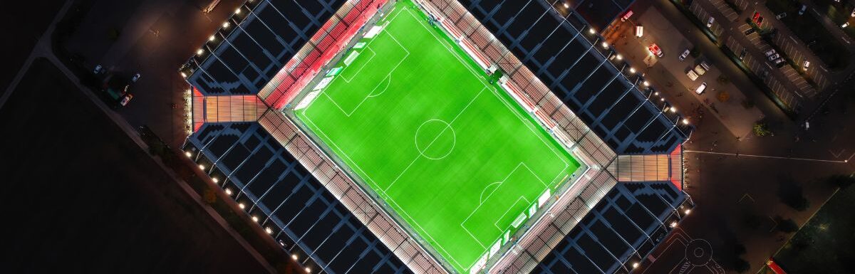 Aerial night view over illuminated Mewa Arena in Mainz, Rhineland-Palatinate, Germany.