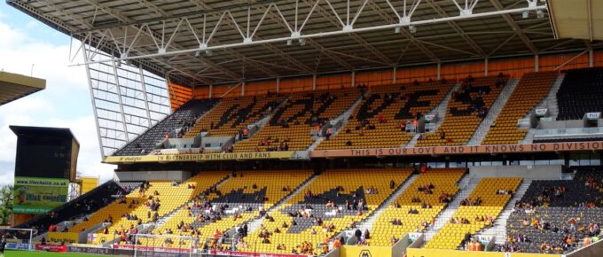 Molineux Stadium with a few people inside during daytime in Wolverhampton, Midlands, England, United Kingdom.