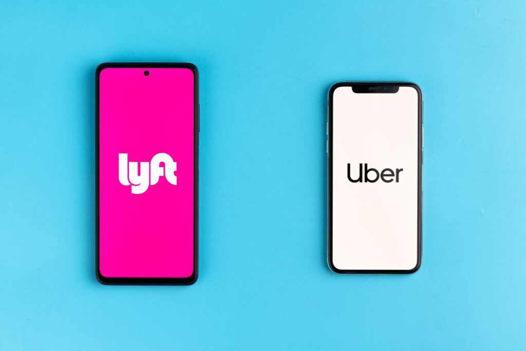 Uber and Lyft apps on two different phones.